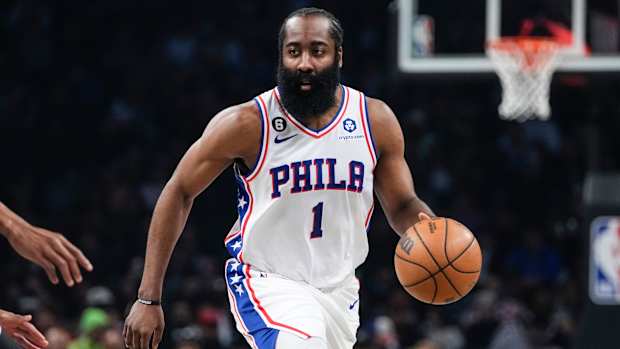 76ers guard James Harden dribbles the ball during a playoff game against the Nets.